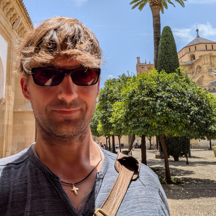me in the inner courtyard of the mezquita catedral of córdoba